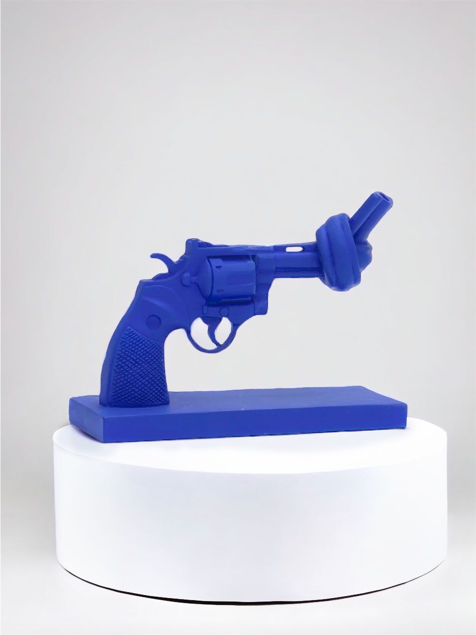 The Knotted Gun cobalt blue sculpture by non-violence art project.